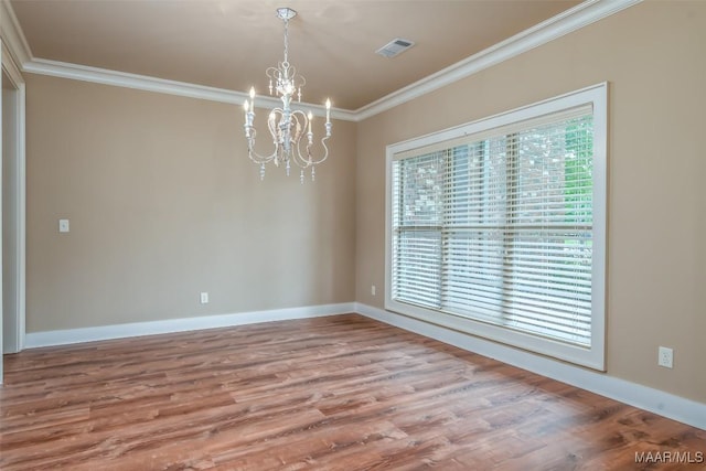 8460 Rockbridge Cir, Montgomery, AL 36116 - unfurnished room with a chandelier, ornamental molding, wood finished floors, and baseboards