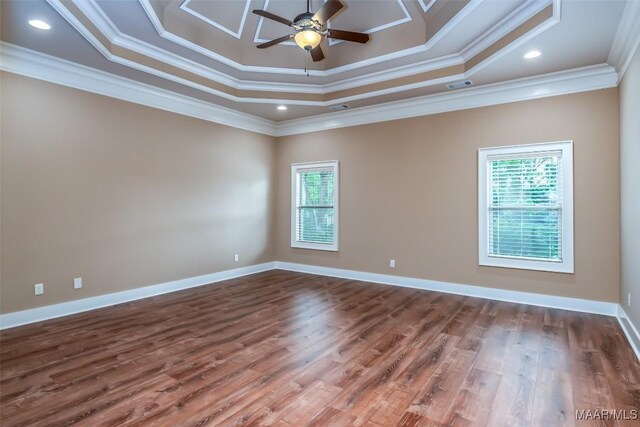 8460 Rockbridge Cir, Montgomery, AL 36116 - empty room with crown molding, plenty of natural light, a ceiling fan, wood finished floors, and baseboards