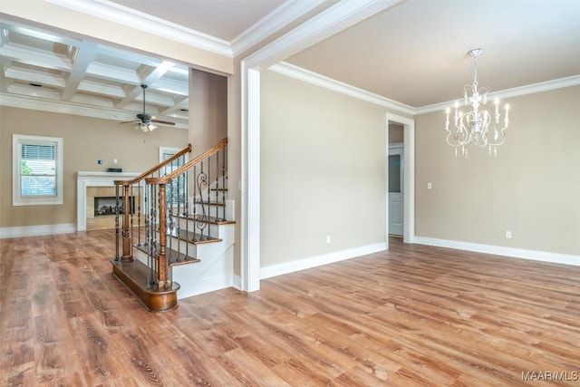 8460 Rockbridge Cir, Montgomery, AL 36116 - unfurnished room featuring stairway, wood finished floors, a chandelier, ceiling fan, and beamed ceiling