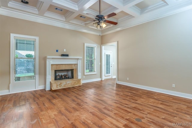 8460 Rockbridge Cir, Montgomery, AL 36116 - unfurnished living room with a ceiling fan, wood finished floors, a tiled fireplace, ornamental molding, and baseboards