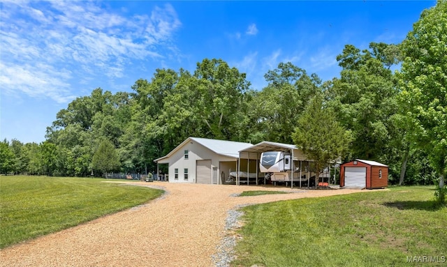 13871 Old Pike Rd, Mathews, AL 36052 - view of front of property featuring an outbuilding, a front lawn, a detached garage, and a carport
