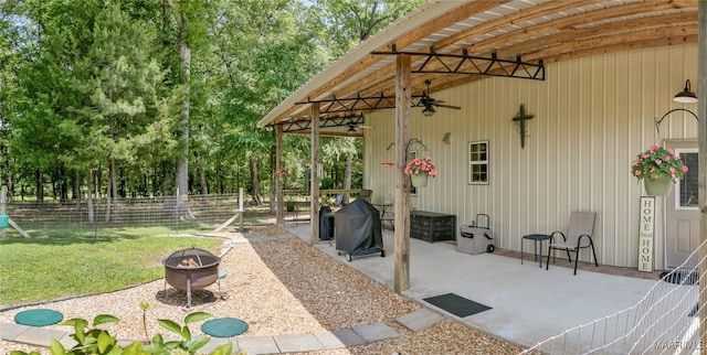 13871 Old Pike Rd, Mathews, AL 36052 - view of patio with an outdoor fire pit, ceiling fan, and view of scattered trees