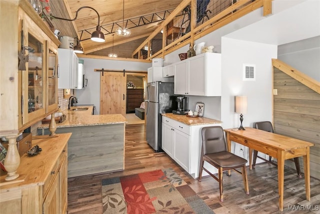 13871 Old Pike Rd, Mathews, AL 36052 - kitchen featuring a barn door, freestanding refrigerator, a sink, wood ceiling, and dark wood finished floors