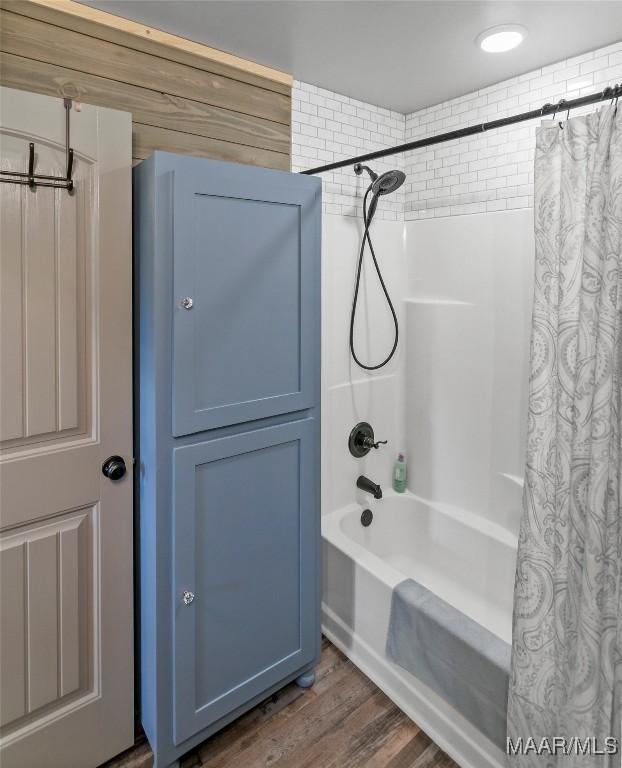13871 Old Pike Rd, Mathews, AL 36052 - full bathroom featuring shower / bath combination with curtain and wood finished floors