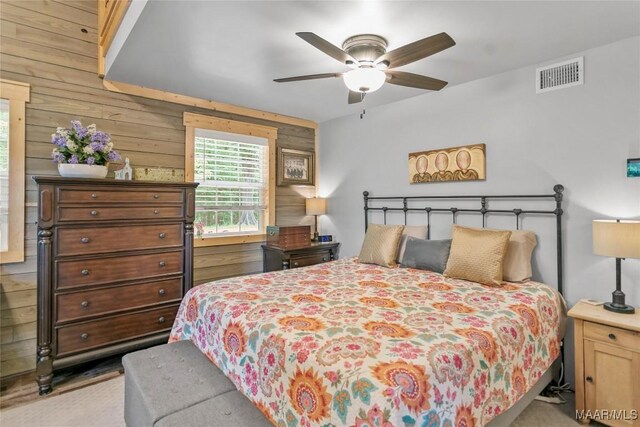 13871 Old Pike Rd, Mathews, AL 36052 - bedroom with wood walls and a ceiling fan