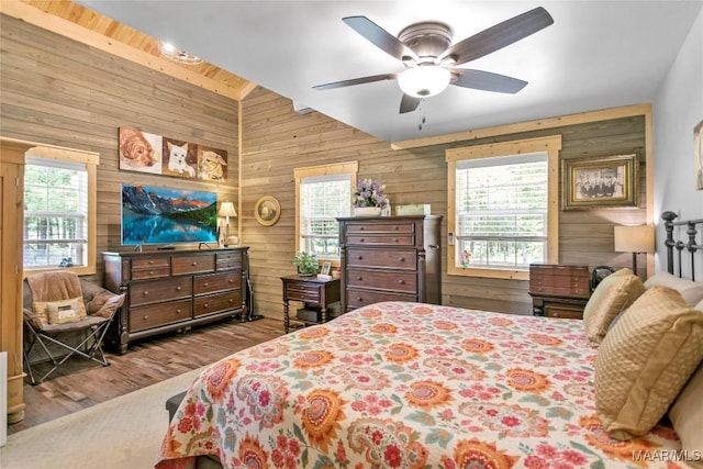 13871 Old Pike Rd, Mathews, AL 36052 - bedroom with wooden walls, wood finished floors, lofted ceiling, and ceiling fan