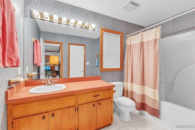300 Elmore Rd, Titus, AL 36080 - bathroom with wallpapered walls, vanity, toilet, tile patterned floors, and shower / tub combo