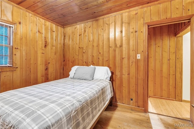 300 Elmore Rd, Titus, AL 36080 - bedroom with hardwood / wood-style floors, wooden ceiling, and wooden walls