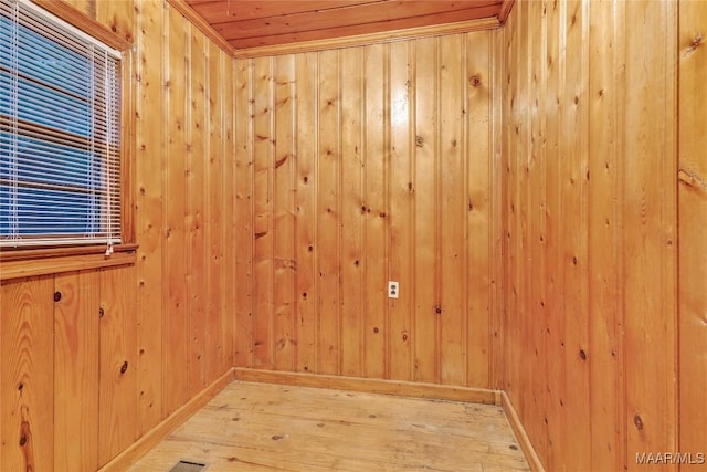 300 Elmore Rd, Titus, AL 36080 - unfurnished room featuring light wood-type flooring, wooden walls, and baseboards