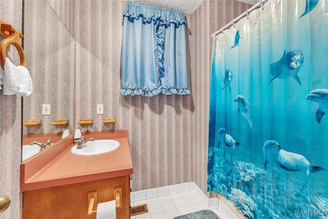 300 Elmore Rd, Titus, AL 36080 - bathroom featuring wallpapered walls, tile patterned flooring, vanity, baseboards, and a shower with shower curtain