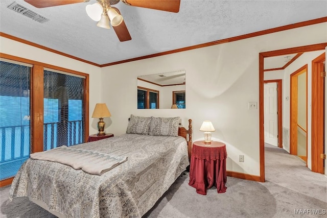 300 Elmore Rd, Titus, AL 36080 - bedroom with carpet, baseboards, ceiling fan, crown molding, and a textured ceiling
