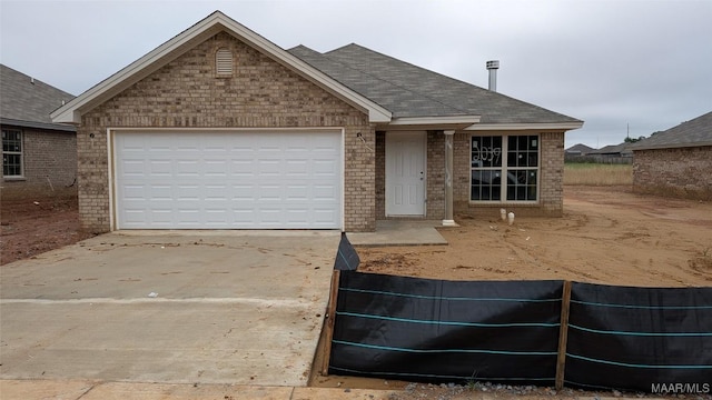 2039 Dawsons Mill Loop, Prattville, AL 36067 - single story home featuring concrete driveway, brick siding, an attached garage, and roof with shingles
