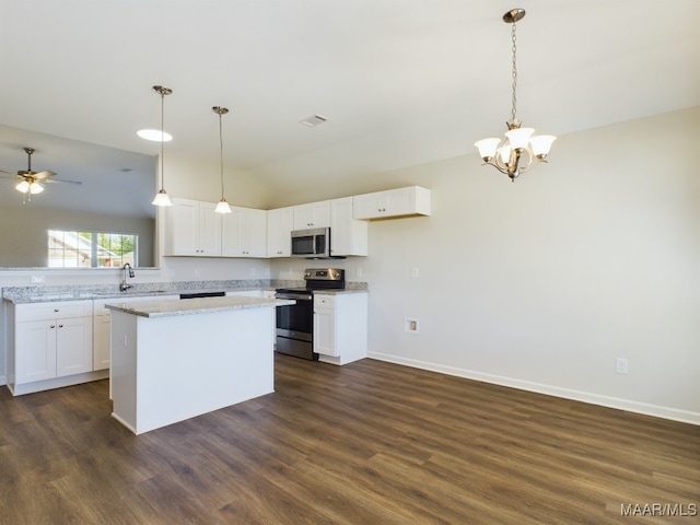 2039 Dawsons Mill Loop, Prattville, AL 36067 - kitchen with appliances with stainless steel finishes, vaulted ceiling, a chandelier, and white cabinetry