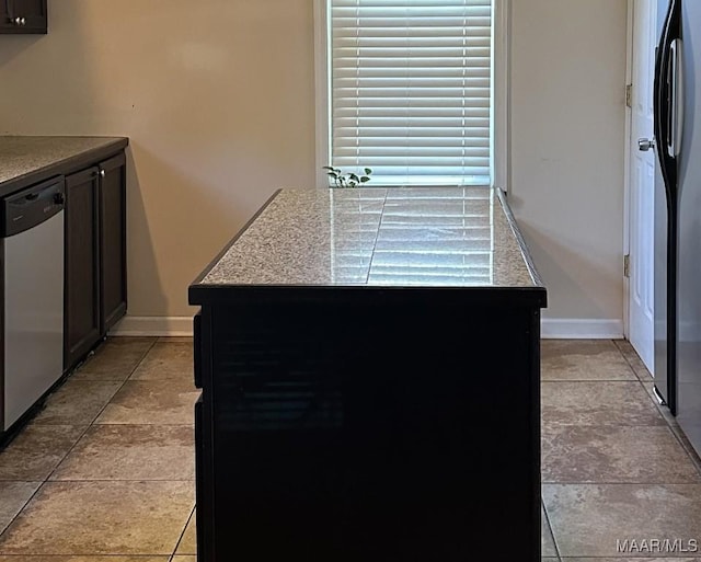 408 W Tuskeena St, Wetumpka, AL 36092 - kitchen with stainless steel dishwasher and baseboards