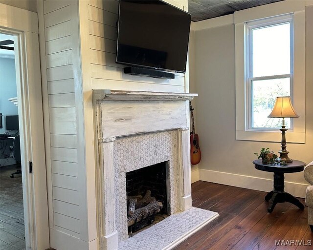 408 W Tuskeena St, Wetumpka, AL 36092 - detailed view of wood finished floors, baseboards, and a fireplace
