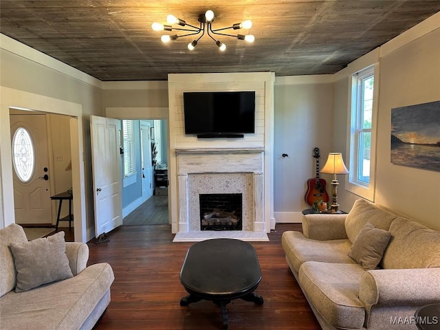 408 W Tuskeena St, Wetumpka, AL 36092 - living area featuring a chandelier, dark wood-style floors, and a fireplace with raised hearth