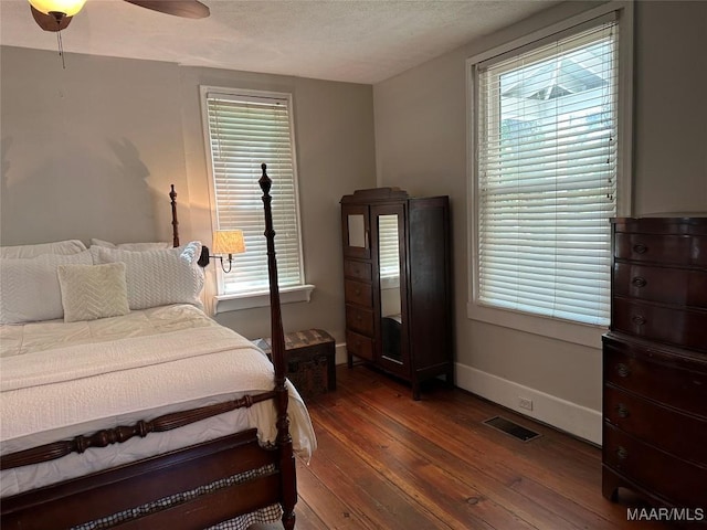 408 W Tuskeena St, Wetumpka, AL 36092 - bedroom featuring wood-type flooring, baseboards, a ceiling fan, and a textured ceiling