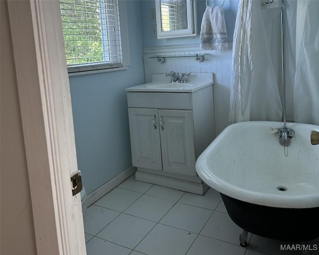 408 W Tuskeena St, Wetumpka, AL 36092 - full bath with a freestanding tub, vanity, and tile patterned floors