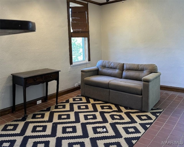 408 W Tuskeena St, Wetumpka, AL 36092 - living room featuring dark tile patterned flooring, baseboards, and a textured wall