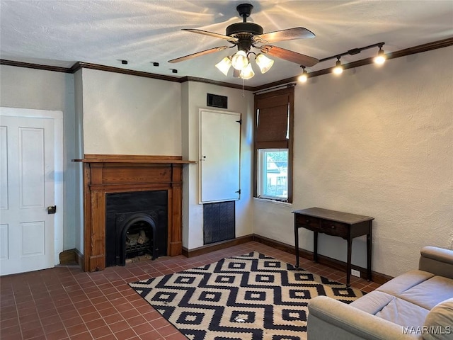 408 W Tuskeena St, Wetumpka, AL 36092 - living area featuring tile patterned flooring, a ceiling fan, ornamental molding, and a fireplace