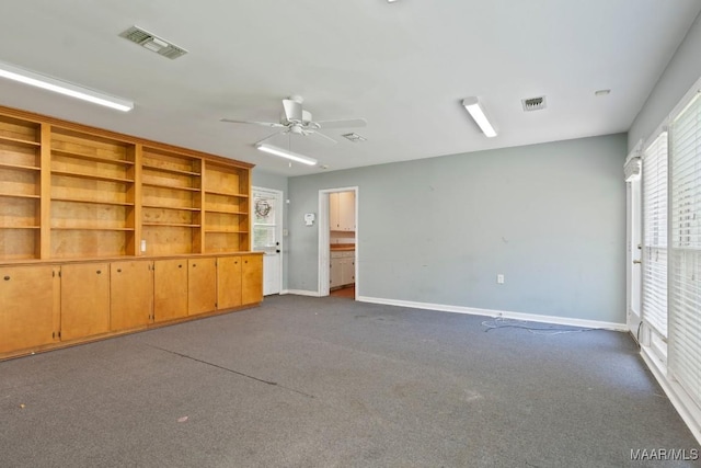 3158 Partridge Ln, Montgomery, AL 36111 - empty room featuring ceiling fan, dark carpet, and baseboards