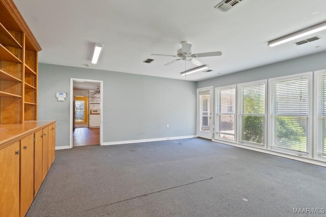 3158 Partridge Ln, Montgomery, AL 36111 - spare room with dark carpet, baseboards, and a ceiling fan