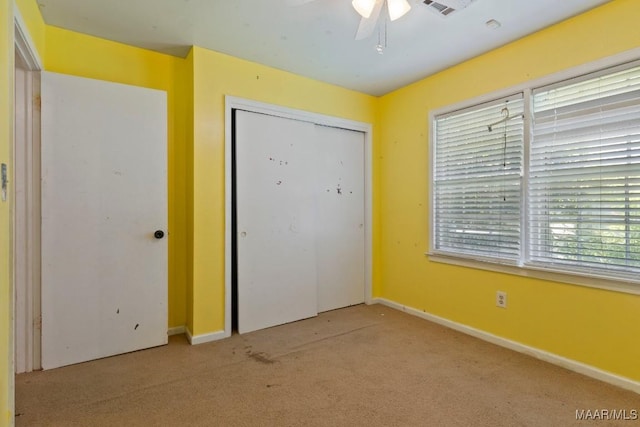 3158 Partridge Ln, Montgomery, AL 36111 - unfurnished bedroom featuring carpet floors, baseboards, a closet, and a ceiling fan