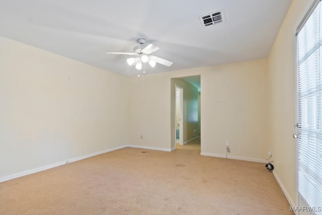 3158 Partridge Ln, Montgomery, AL 36111 - unfurnished room with light colored carpet, baseboards, and a ceiling fan