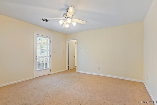 3158 Partridge Ln, Montgomery, AL 36111 - spare room featuring light carpet, ceiling fan, and baseboards