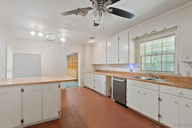 3158 Partridge Ln, Montgomery, AL 36111 - kitchen with dishwasher, a sink, wallpapered walls, white cabinets, and butcher block countertops
