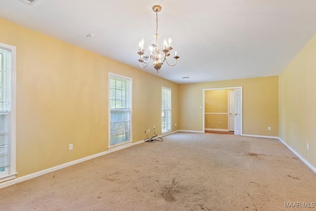 3158 Partridge Ln, Montgomery, AL 36111 - carpeted empty room featuring a chandelier and baseboards