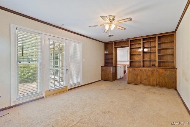 3158 Partridge Ln, Montgomery, AL 36111 - unfurnished living room with ornamental molding, light carpet, ceiling fan, and baseboards