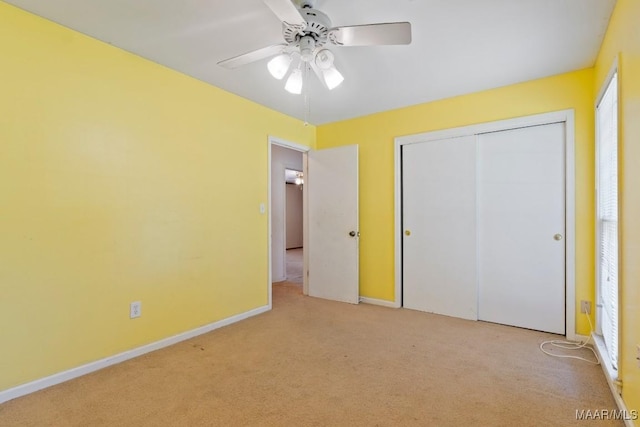 3158 Partridge Ln, Montgomery, AL 36111 - unfurnished bedroom featuring light colored carpet, a closet, baseboards, and ceiling fan