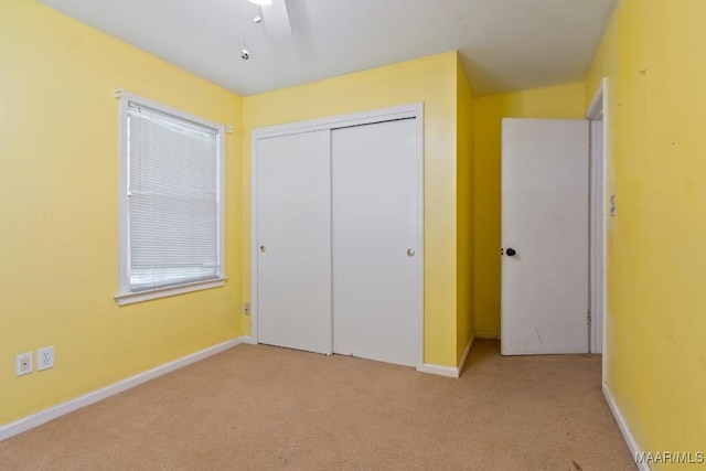 3158 Partridge Ln, Montgomery, AL 36111 - unfurnished bedroom with carpet floors, a closet, baseboards, and ceiling fan