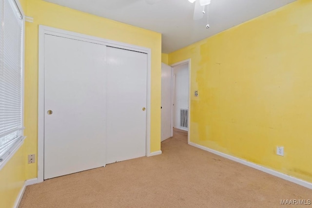 3158 Partridge Ln, Montgomery, AL 36111 - unfurnished bedroom with carpet floors, a closet, baseboards, and ceiling fan