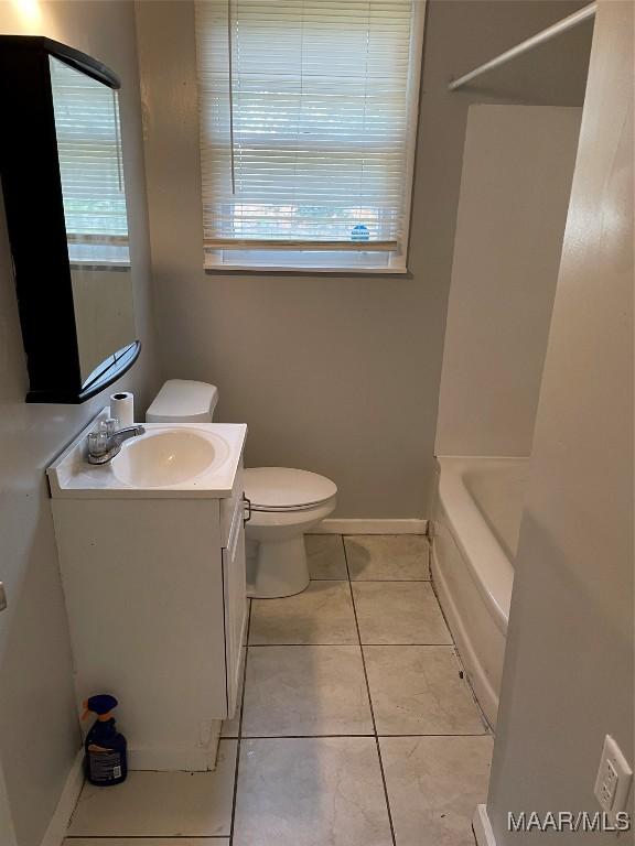 620 6th St, Montgomery, AL 36110 - full bathroom featuring healthy amount of natural light, vanity, toilet, and tile patterned flooring