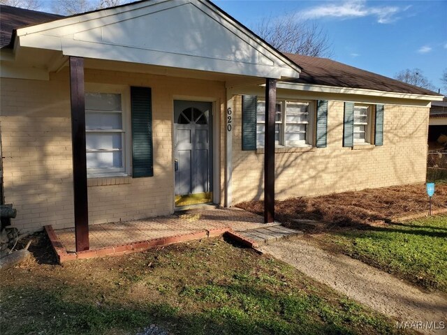 620 6th St, Montgomery, AL 36110 - doorway to property featuring brick siding