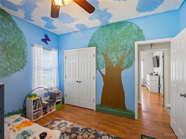 33 Glendale Acres Acres, Eclectic, AL 36024 - bedroom with wood finished floors, a closet, and ceiling fan