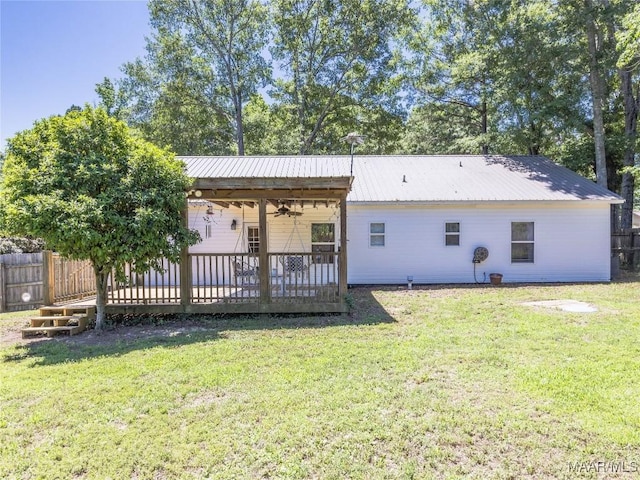 33 Glendale Acres Acres, Eclectic, AL 36024 - back of house with a ceiling fan and metal roof