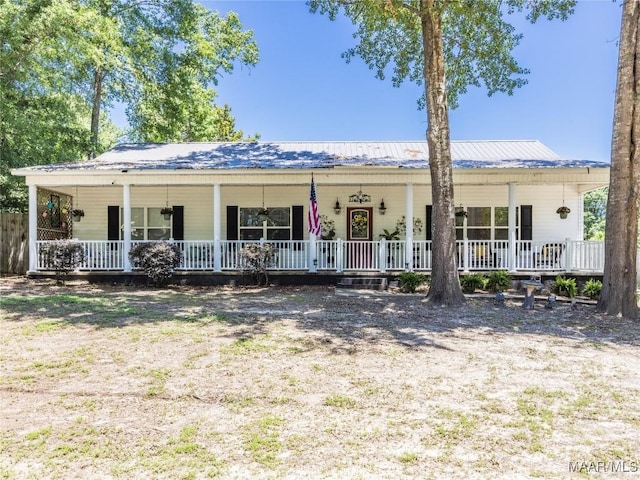 33 Glendale Acres Acres, Eclectic, AL 36024 - view of front facade featuring a porch and metal roof
