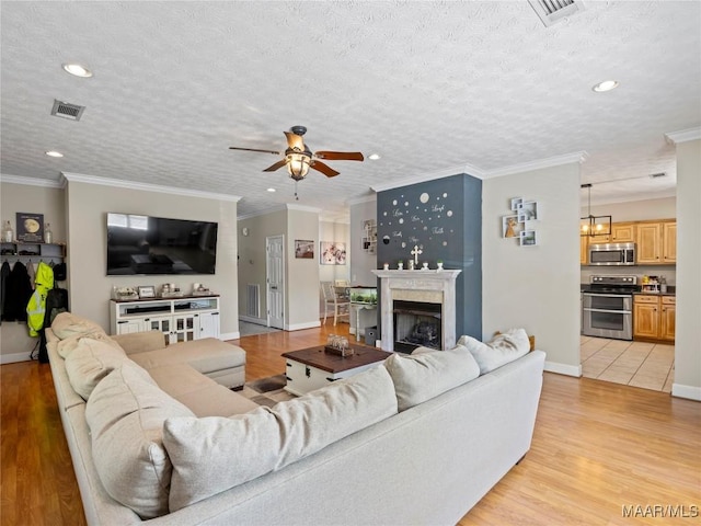 33 Glendale Acres Acres, Eclectic, AL 36024 - living room with a ceiling fan, baseboards, ornamental molding, recessed lighting, and light wood-type flooring