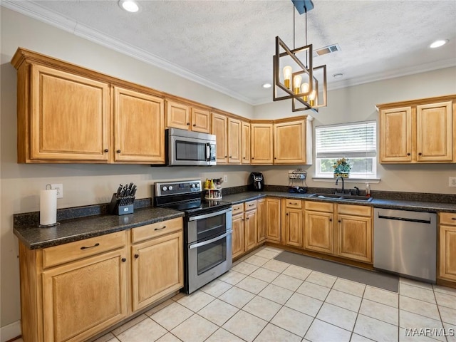 33 Glendale Acres Acres, Eclectic, AL 36024 - kitchen with appliances with stainless steel finishes, a sink, recessed lighting, light tile patterned floors, and hanging light fixtures