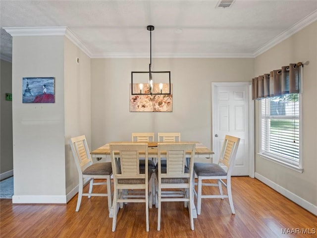 33 Glendale Acres Acres, Eclectic, AL 36024 - dining space featuring wood finished floors, a chandelier, baseboards, and crown molding
