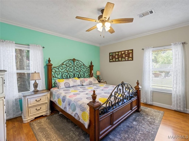 33 Glendale Acres Acres, Eclectic, AL 36024 - bedroom featuring wood finished floors, crown molding, and a ceiling fan