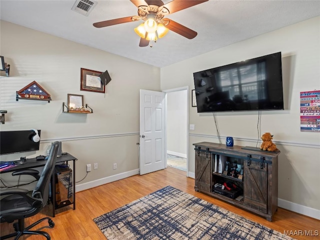 33 Glendale Acres Acres, Eclectic, AL 36024 - home office featuring wood finished floors, ceiling fan, and baseboards