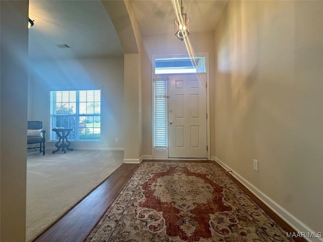 624 Stoneybrooke Way, Montgomery, AL 36117 - entrance foyer with baseboards, wood finished floors, arched walkways, and carpet floors