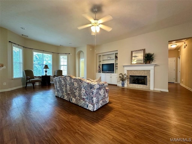 624 Stoneybrooke Way, Montgomery, AL 36117 - living area featuring a ceiling fan, dark wood-type flooring, baseboards, and built in shelves