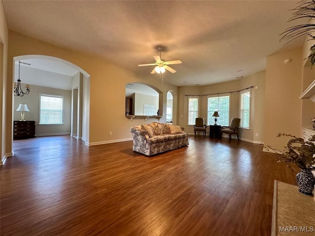 624 Stoneybrooke Way, Montgomery, AL 36117 - living room with dark wood-style flooring, arched walkways, and baseboards