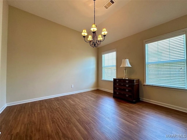 624 Stoneybrooke Way, Montgomery, AL 36117 - spare room featuring dark wood-style floors, a chandelier, and baseboards