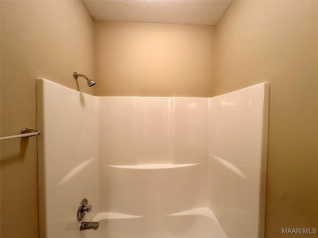 624 Stoneybrooke Way, Montgomery, AL 36117 - bathroom with tub / shower combination and a textured ceiling